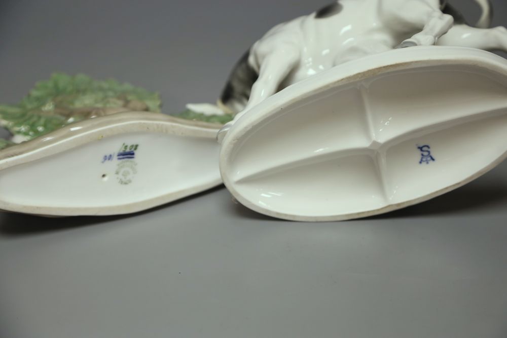 A Royal Copenhagen deer, model 2051 and a Sitzendorf figure group of a man and a cow.